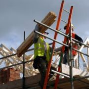 A pair of roofers working on a construction site in Manchester, England. No sharpening in camera or pp.