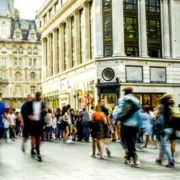 A busy street scene with crowds of motion blurred people in London's west end