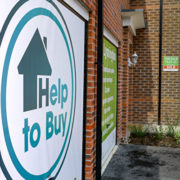 MIDDLEWICH, ENGLAND - MAY 20:  Marketing signs adorn the front of new homes on a housing development on May 20, 2014 in Middlewich, England. Official figures have shown that house prices have risen by 8% in the year ending in March. There have been calls by some experts for the UK Help to Buy scheme to be scaled down as it boosts the property market.  (Photo by Christopher Furlong/Getty Images)